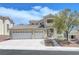 Charming two-story home features a three-car garage and drought resistant landscaping at 3079 Evening Mist Ave, Henderson, NV 89052
