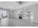 Spacious living room with marble floors, a fireplace and access to the backyard at 3079 Evening Mist Ave, Henderson, NV 89052