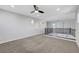 Spacious loft featuring neutral color carpet, ample natural light and well-appointed black metal and wood railing at 3079 Evening Mist Ave, Henderson, NV 89052