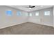Well lit upstairs living area featuring neutral color carpet, ample natural light and built in cabinets at 3079 Evening Mist Ave, Henderson, NV 89052