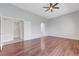 Large main bedroom with beautiful hardwood floors, a ceiling fan, and ensuite bathroom access at 3079 Evening Mist Ave, Henderson, NV 89052