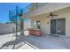 Spacious patio with outdoor kitchen, spiral staircase, and ample room for entertaining guests at 3079 Evening Mist Ave, Henderson, NV 89052