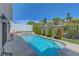 Private backyard oasis with a shimmering pool, relaxing spa, and lush landscaping, perfect for outdoor entertaining at 3079 Evening Mist Ave, Henderson, NV 89052