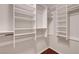 Spacious walk-in closet with built-in shelving and hardwood floors at 3079 Evening Mist Ave, Henderson, NV 89052
