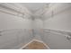 Walk-in closet featuring ample shelving and a tile floor at 3079 Evening Mist Ave, Henderson, NV 89052
