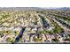 Panoramic view of a quiet suburban neighborhood featuring diverse architecture and mature trees at 3079 Paseo Mountain Ave, Henderson, NV 89052