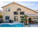 Inviting backyard featuring a sparkling pool, patio dining, and lush tropical landscaping at 3079 Paseo Mountain Ave, Henderson, NV 89052