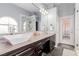 Modern bathroom featuring dual sinks, stylish cabinetry, and a well-lit mirror at 3079 Paseo Mountain Ave, Henderson, NV 89052