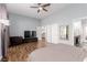Open bedroom showcasing wood floors, ceiling fan, and ample space at 3079 Paseo Mountain Ave, Henderson, NV 89052