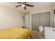 This bedroom features a ceiling fan, desk area and closet with sliding doors at 3079 Paseo Mountain Ave, Henderson, NV 89052