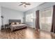 Spacious bedroom with wood floors, slider to patio, and ceiling fan at 3079 Paseo Mountain Ave, Henderson, NV 89052