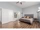 Relaxing bedroom with wood floors, large bed, and neutral color palette at 3079 Paseo Mountain Ave, Henderson, NV 89052