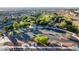 Aerial park featuring parking, playground, picnic pavilion, and lush green spaces in community at 3079 Paseo Mountain Ave, Henderson, NV 89052
