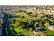 Community park featuring soccer field, playground, trees, and walking paths, surrounded by homes at 3079 Paseo Mountain Ave, Henderson, NV 89052