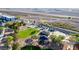 Aerial view of park featuring playground, parking, modern building, and desert landscape in background at 3079 Paseo Mountain Ave, Henderson, NV 89052