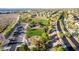Aerial view of a park with baseball field, playground, parking lot, and mature trees at 3079 Paseo Mountain Ave, Henderson, NV 89052