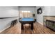 Spacious game room with a fireplace, pool table, and bar seating, perfect for entertaining at 3079 Paseo Mountain Ave, Henderson, NV 89052