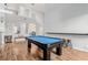 Spacious game room featuring a pool table, second story overlook, and bar seating at 3079 Paseo Mountain Ave, Henderson, NV 89052
