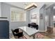 Bright home office features modern desk, colorful rug, and large window with natural light at 3079 Paseo Mountain Ave, Henderson, NV 89052
