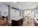 Open kitchen featuring an island with breakfast bar and a dining area with natural light at 3079 Paseo Mountain Ave, Henderson, NV 89052