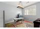 Bright home office with a modern desk, stylish lighting, and a window with shutters at 3079 Paseo Mountain Ave, Henderson, NV 89052