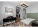 Versatile office space connects to game room through archway and features modern table at 3079 Paseo Mountain Ave, Henderson, NV 89052