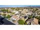 Neighborhood street view showcasing a community with well-manicured lawns, palm trees, and mountain backdrop at 3079 Paseo Mountain Ave, Henderson, NV 89052