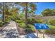 Inviting fitness trail with information signage amid lush greenery and trees alongside a sidewalk at 3104 Waterview Dr, Las Vegas, NV 89117