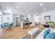 Bright, open-concept living area featuring a modern kitchen with a center island and stylish furniture at 3104 Waterview Dr, Las Vegas, NV 89117