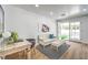 Bright office with desk, seating, French doors to backyard, and hardwood floors at 3104 Waterview Dr, Las Vegas, NV 89117