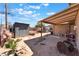 Backyard view with sheds, covered patio, and storage area at 3112 Twining Ave, North Las Vegas, NV 89030