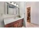Bathroom with vanity, mirror, and neutral-toned tile flooring at 3112 Twining Ave, North Las Vegas, NV 89030