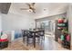 Bright dining area with tile flooring, ceiling fan, dining table, and natural light from the window at 3112 Twining Ave, North Las Vegas, NV 89030
