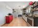 Spacious kitchen with neutral tile floors, and modern appliances, that opens to the dining area at 3112 Twining Ave, North Las Vegas, NV 89030