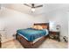 Cozy main bedroom with a dark wood frame bed and tile floors at 3112 Twining Ave, North Las Vegas, NV 89030
