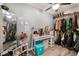 Spacious walk-in closet with ample hanging and storage space, a desk, and great mirror at 3112 Twining Ave, North Las Vegas, NV 89030