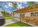 Serene backyard with a pergola, artificial turf, and privacy fencing at 325 Heather Dr, Henderson, NV 89002