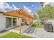 Inviting backyard with pergola, outdoor seating, and artificial grass at 325 Heather Dr, Henderson, NV 89002