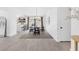 Bright dining room featuring a modern chandelier, a wood table set on an area rug, and a door to the backyard at 325 Heather Dr, Henderson, NV 89002