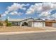 Charming single-story home featuring a two-car garage and low-maintenance desert landscaping at 325 Heather Dr, Henderson, NV 89002