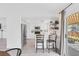 Bright kitchen with white cabinets, stainless steel appliances, breakfast bar and outdoor view at 325 Heather Dr, Henderson, NV 89002