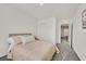 Bedroom with carpeted floors, light colored walls and walk in closet with sliding doors at 3762 Sonrisa Vista Ave, Henderson, NV 89044