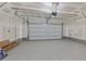 Spacious garage with concrete floors, drywall, and a white garage door at 3762 Sonrisa Vista Ave, Henderson, NV 89044