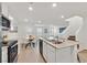 Bright eat-in kitchen features stainless appliances, white cabinetry, and an island at 3762 Sonrisa Vista Ave, Henderson, NV 89044