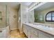 The primary bath features double sinks, marble counters and glass enclosed shower at 4004 Nancy Margarite Ln, Las Vegas, NV 89130