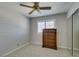 Neutral bedroom with a dark wood dresser, neutral carpet, and a mirrored closet at 4004 Nancy Margarite Ln, Las Vegas, NV 89130