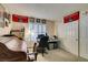 Bedroom setup as office with UNLV decor, large window, and ample closet space at 4004 Nancy Margarite Ln, Las Vegas, NV 89130