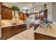 Spacious kitchen featuring granite countertops, stainless steel appliances, and custom wood cabinetry at 4004 Nancy Margarite Ln, Las Vegas, NV 89130