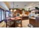 Beautiful kitchen featuring a breakfast nook, custom cabinets, granite countertops, and stainless steel appliances at 4004 Nancy Margarite Ln, Las Vegas, NV 89130