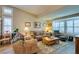 Living room with hardwood floors, natural light from the windows, seating arrangements and tasteful decor at 4004 Nancy Margarite Ln, Las Vegas, NV 89130
